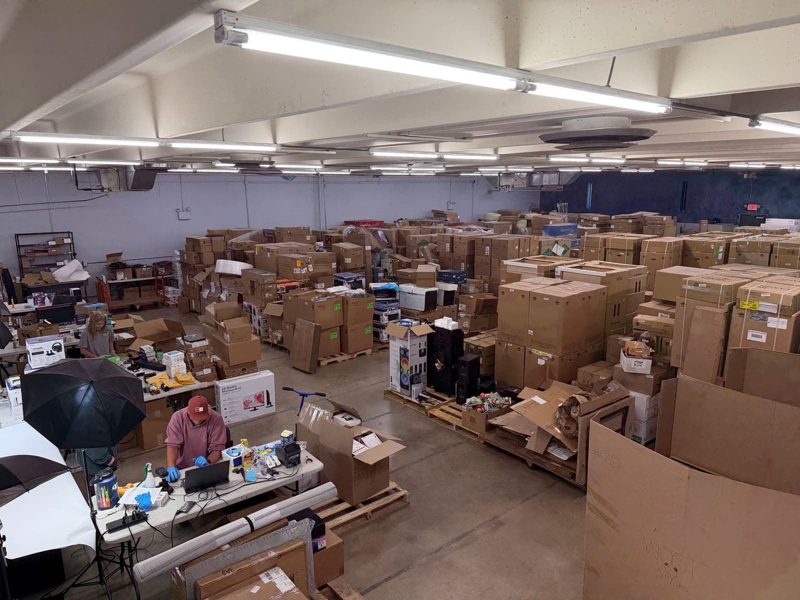 The StreetRobin processing floor stacked with inventory being sorted and graded.