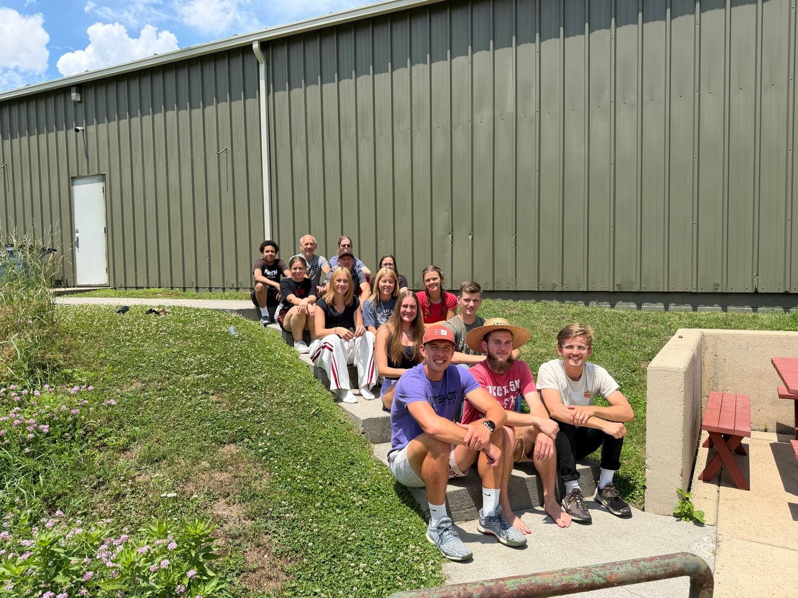 The StreetRobin team gathered outside the facility on a sunny day.